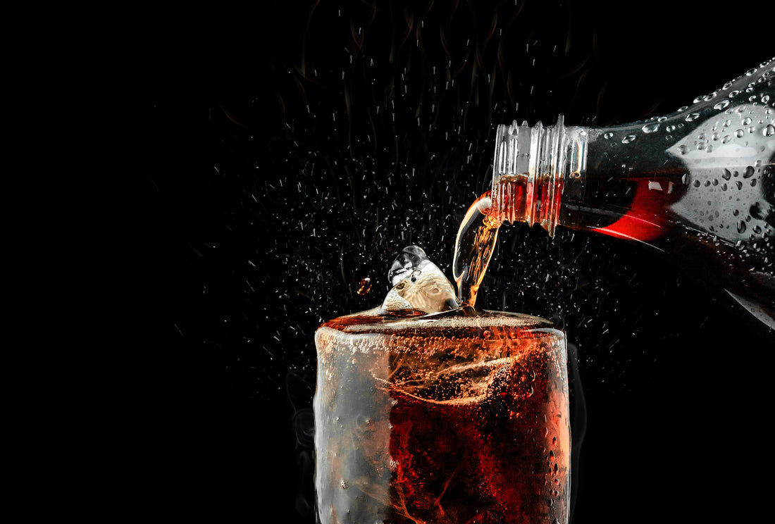 An image of a soda pouring into a glass
